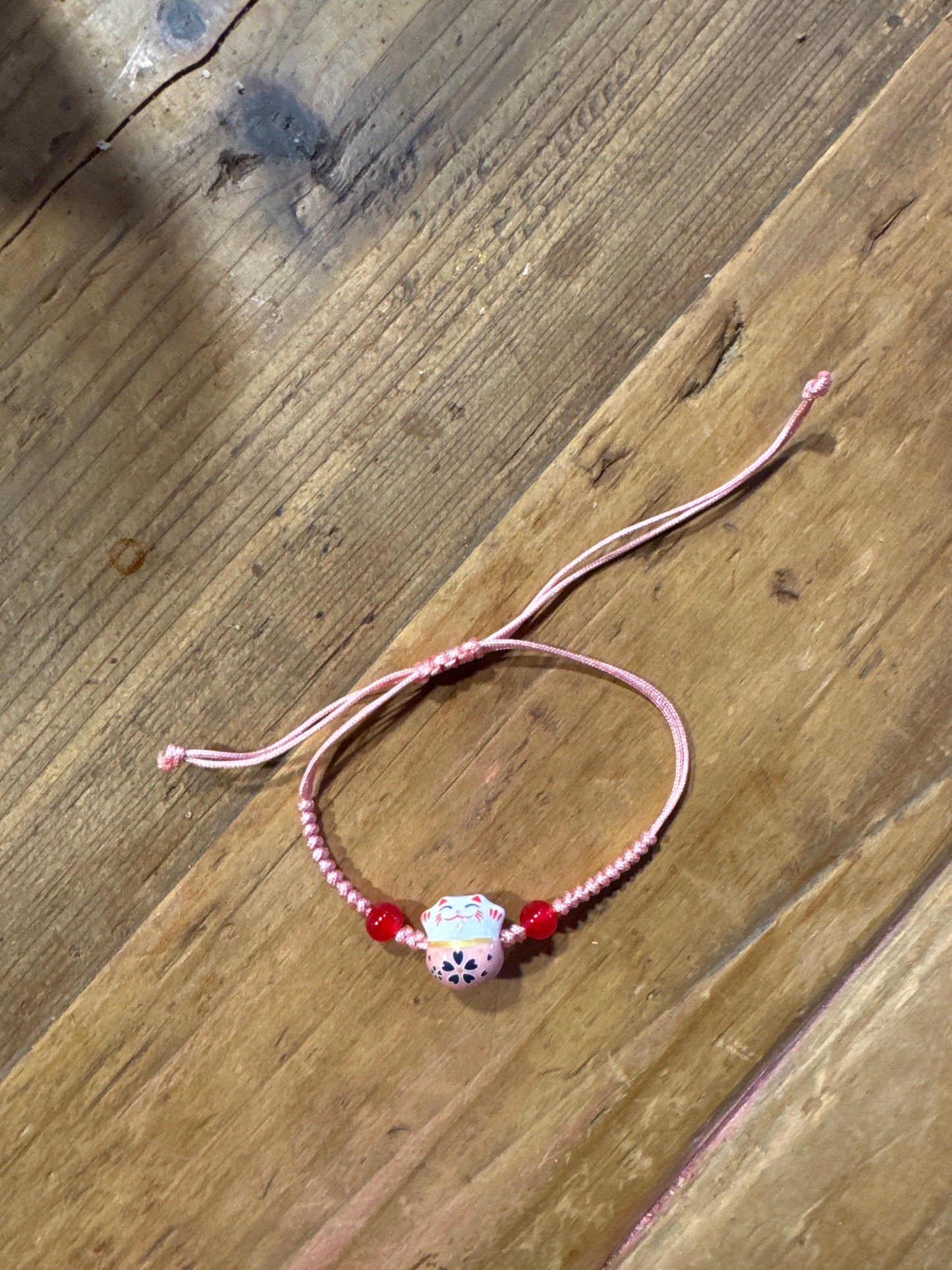 Pulsera gato de la suerte rosa