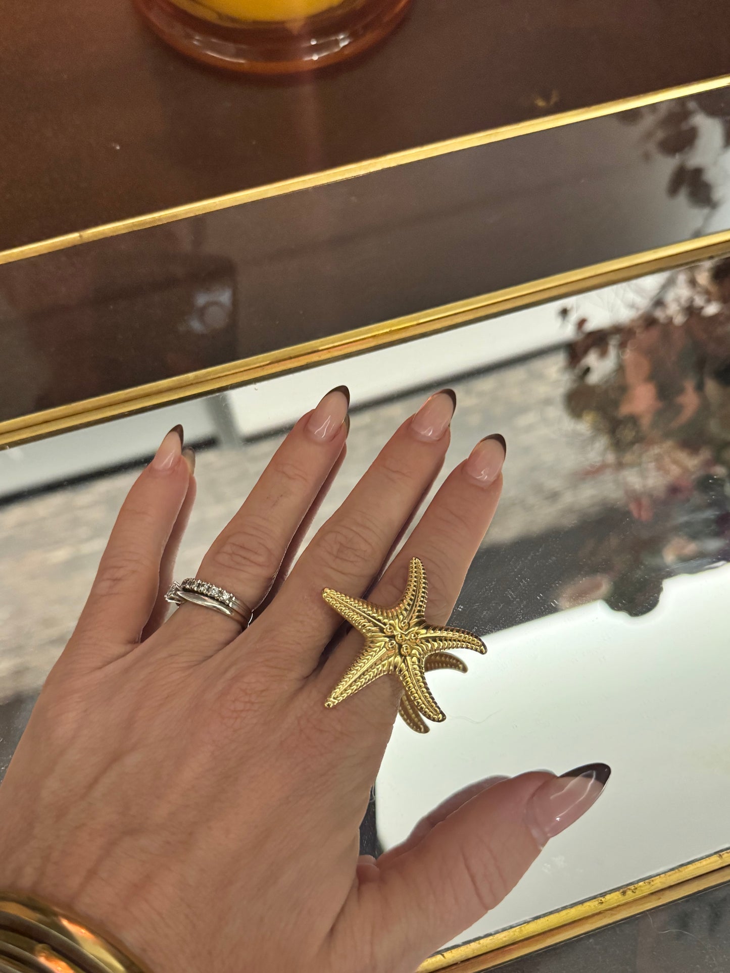 Anillo estrella de mar acero